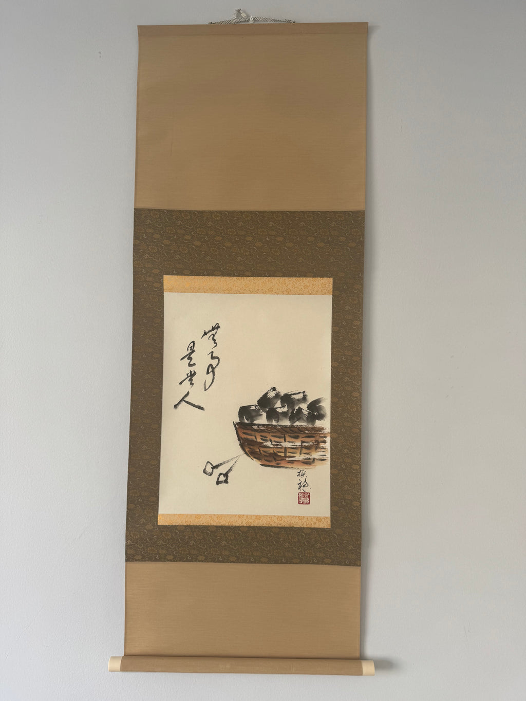Traditional Japanes artwork with calligraphy on a textured brown background