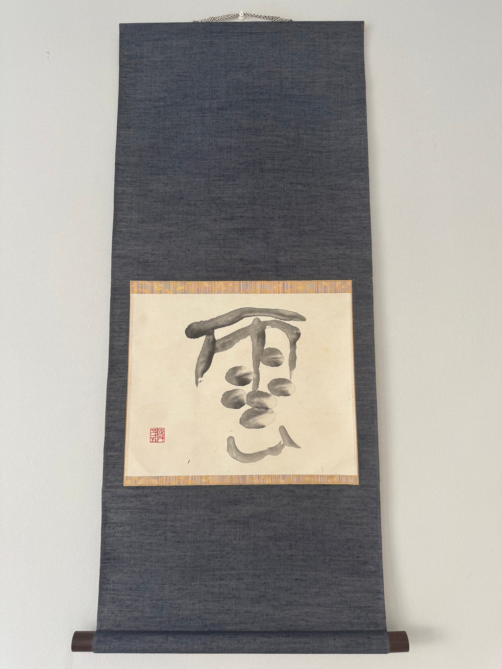 Roll of paper with calligraphy on a plain background