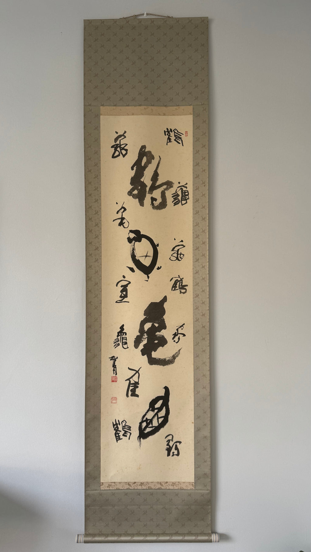 Calligraphy scroll on a gray background