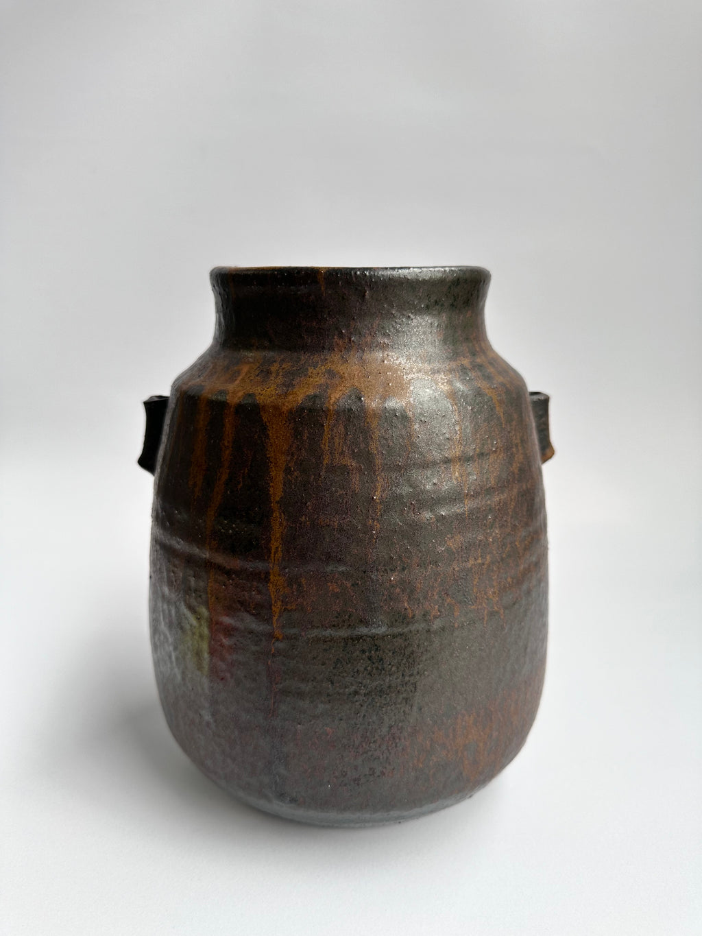 Brown ceramic jar on a white background