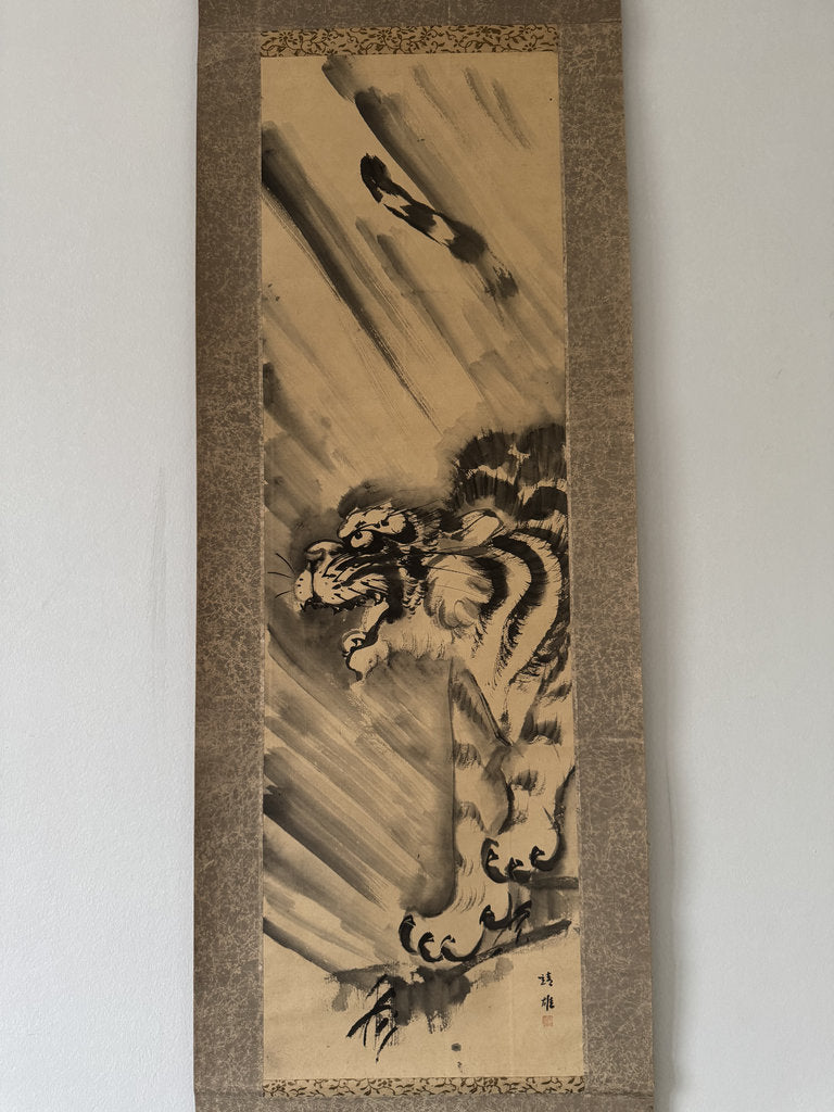 Traditional Japanese artwork of a tiger on a textured paper background