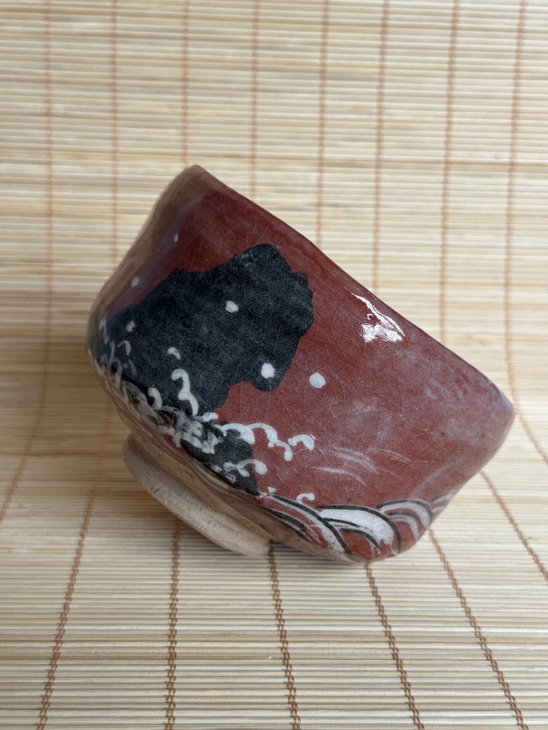 Decorative stone with artistic design on a woven mat