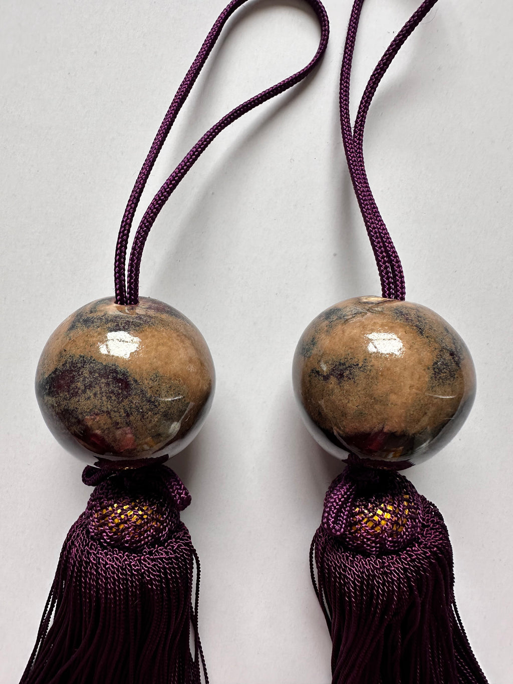 Natural Stone Fūchin with Burgundy Tassels – Japanese Scroll Weight Pair, Earth-Tone Marble Sphere