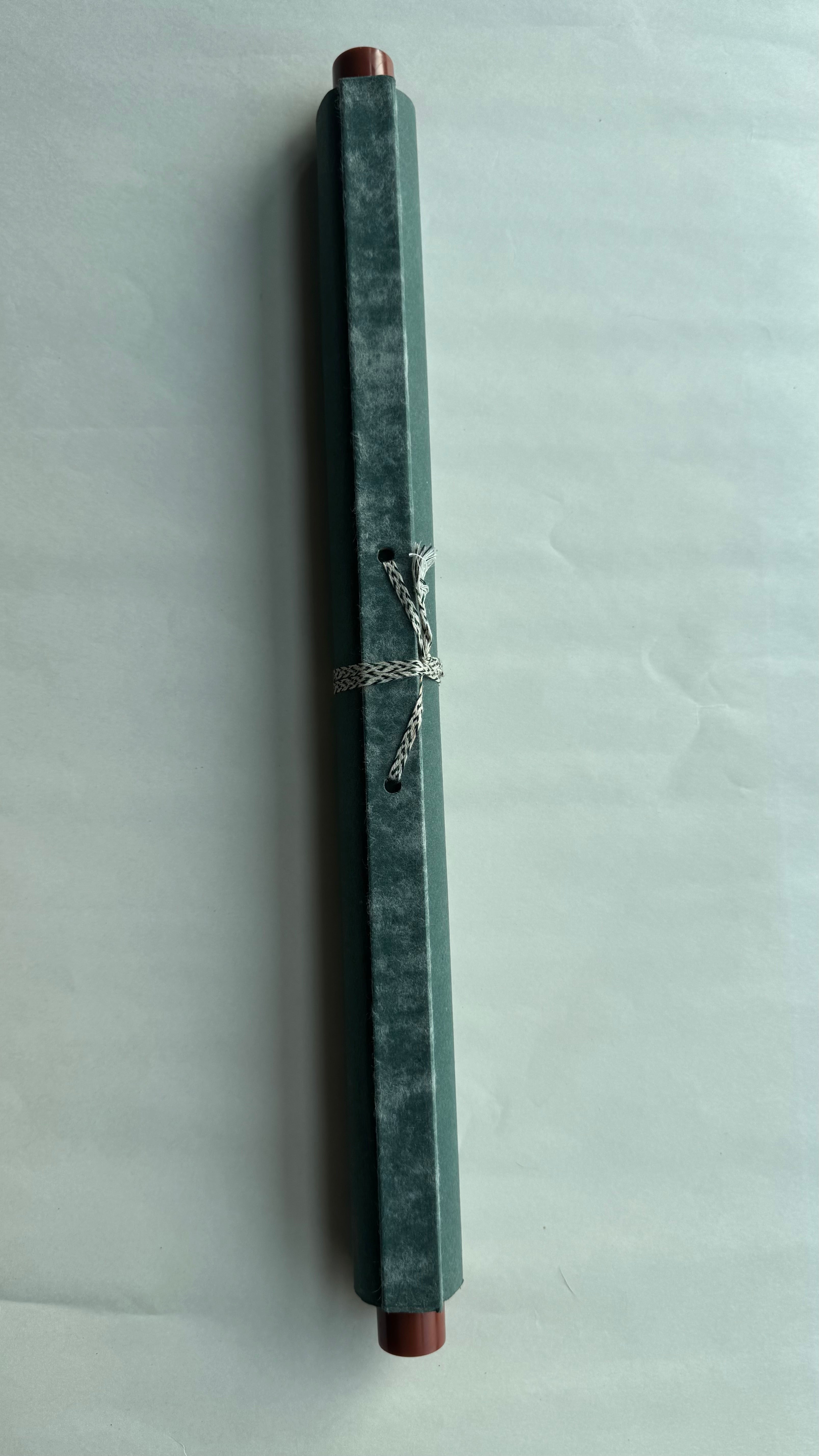 Pen in a decorative box on a light gray background