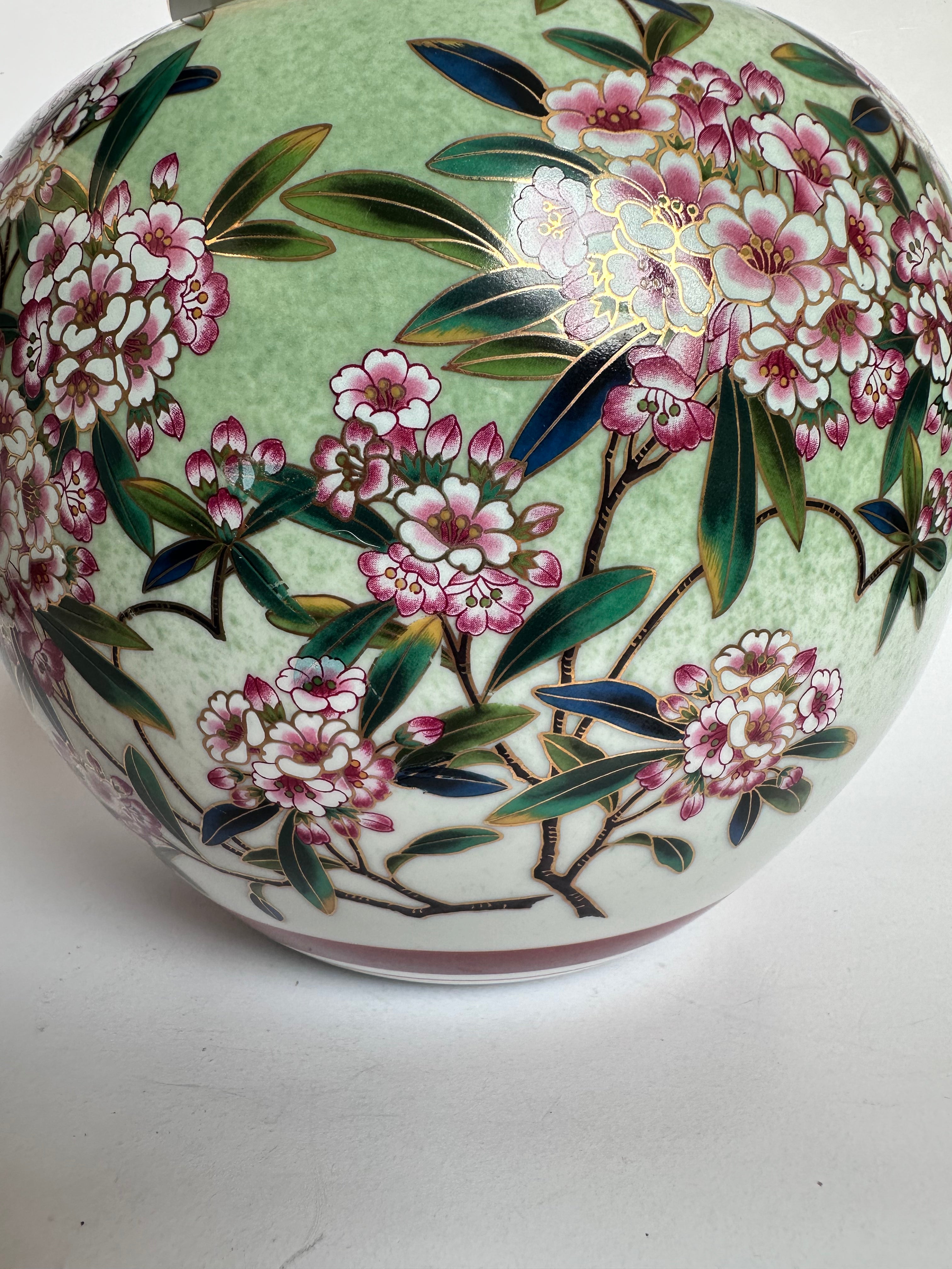 Decorative vase with floral design on a white background
