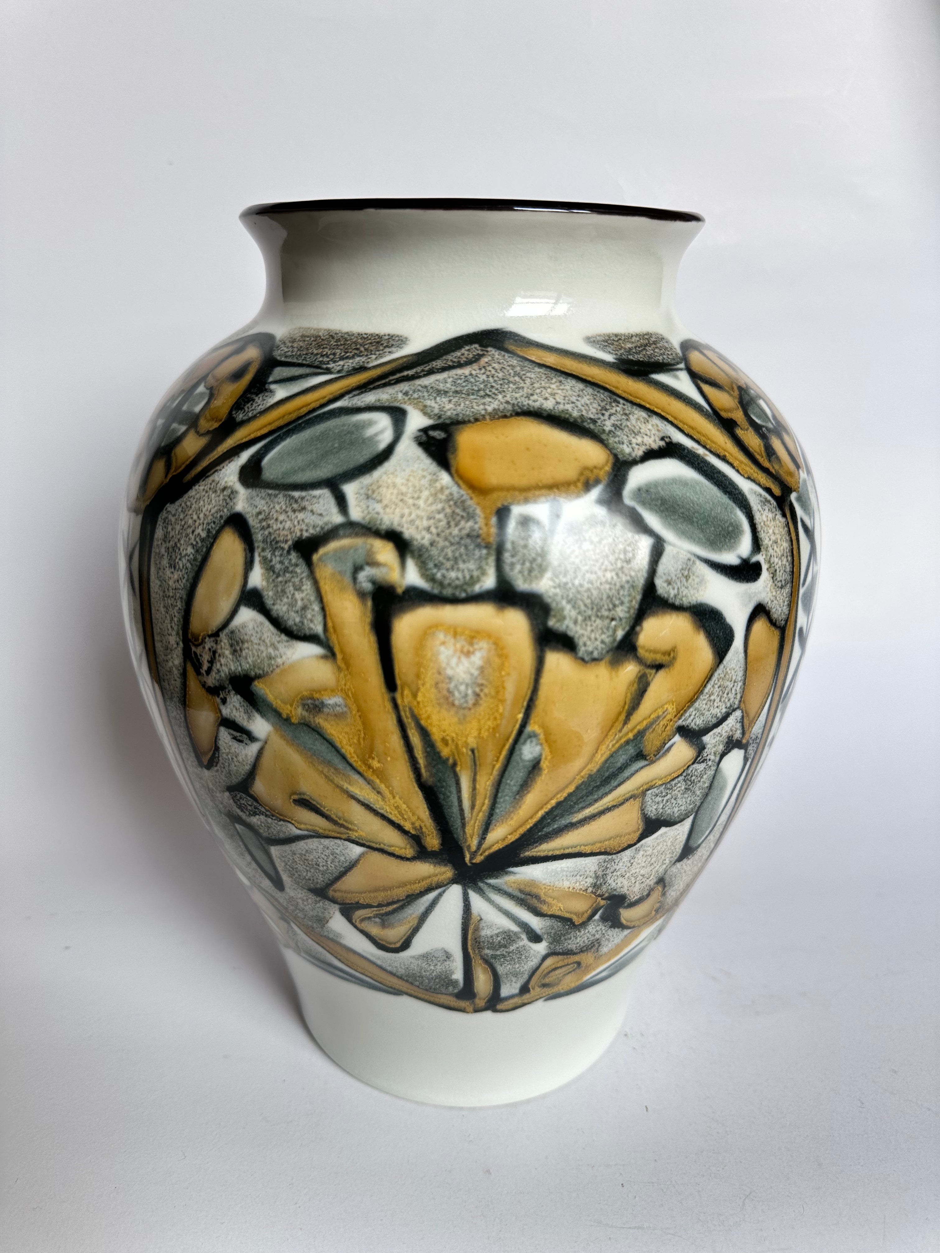 Ceramic vase with decorative design on a white background