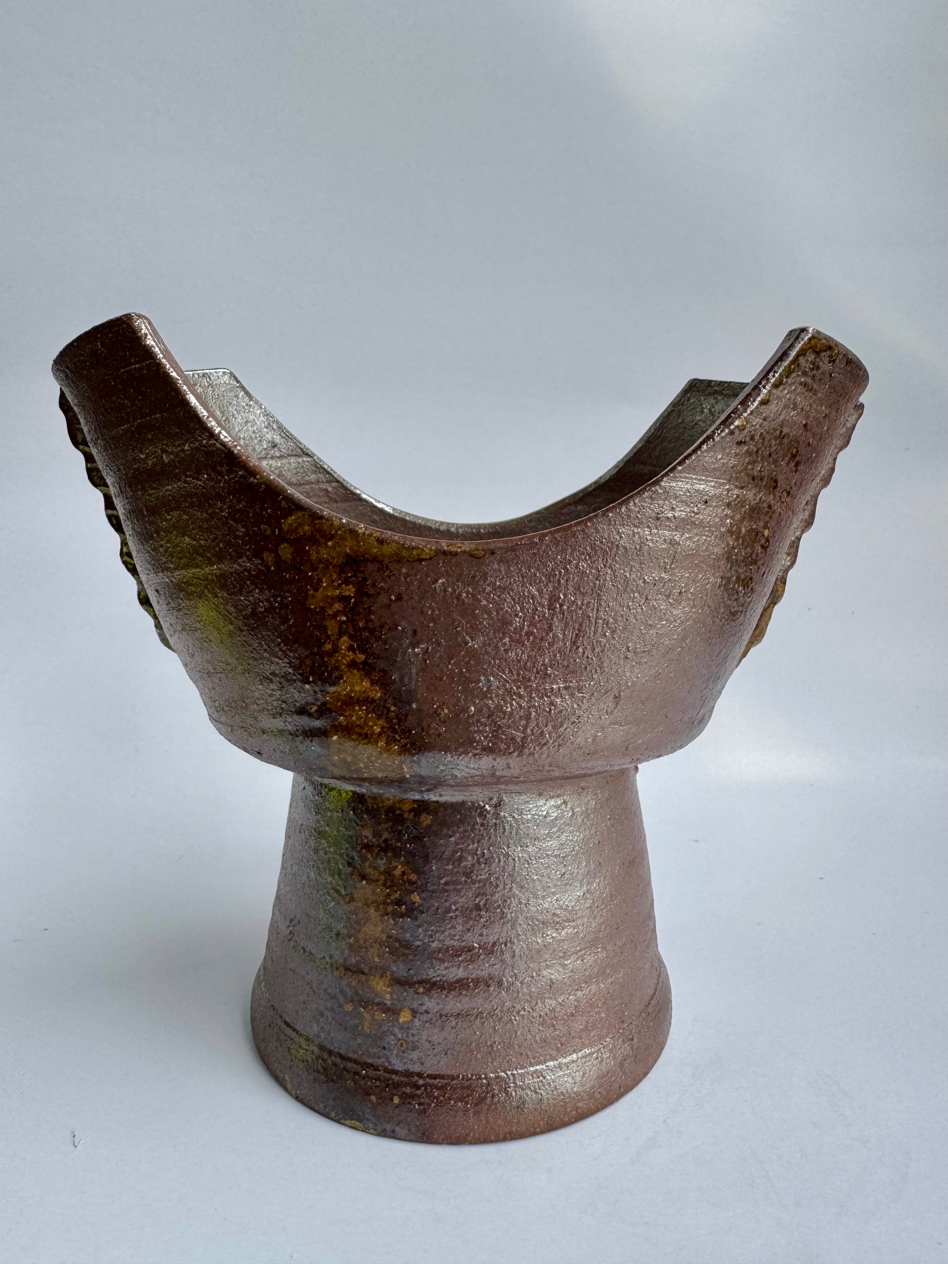 Brown ceramic vase on a white background