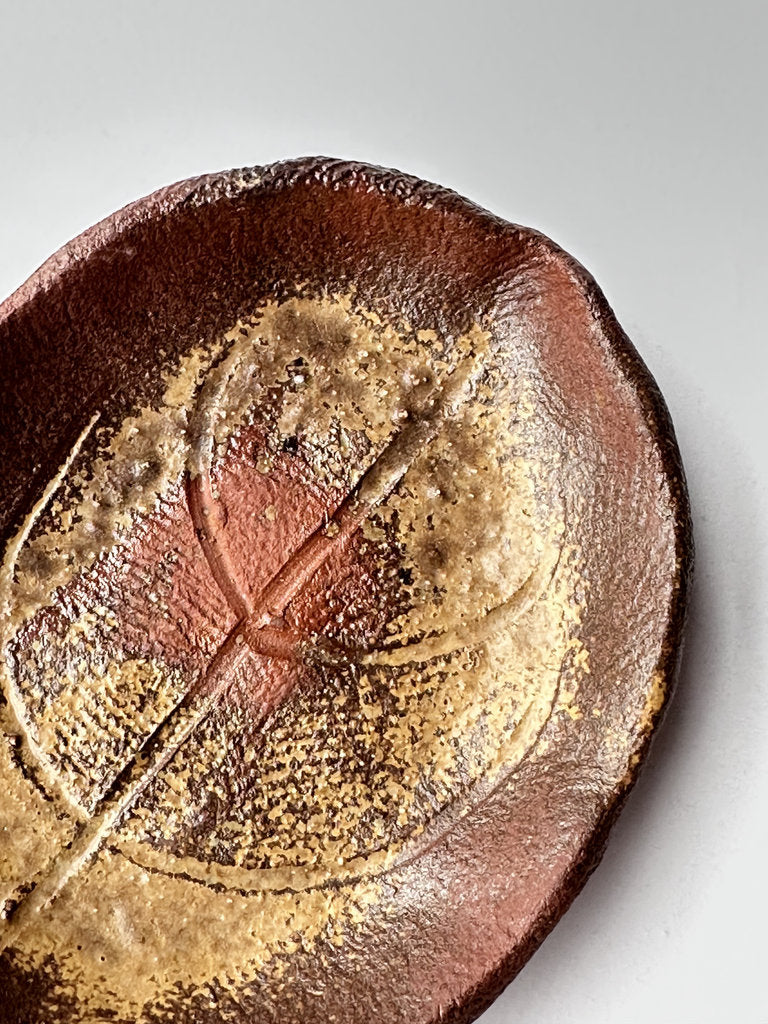 Close-up of a ceramic plate with a star design on a white background