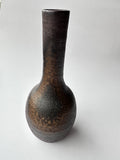 Textured ceramic vase on a white background