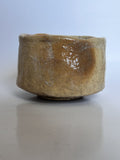 Brown ceramic bowl on a light gray background
