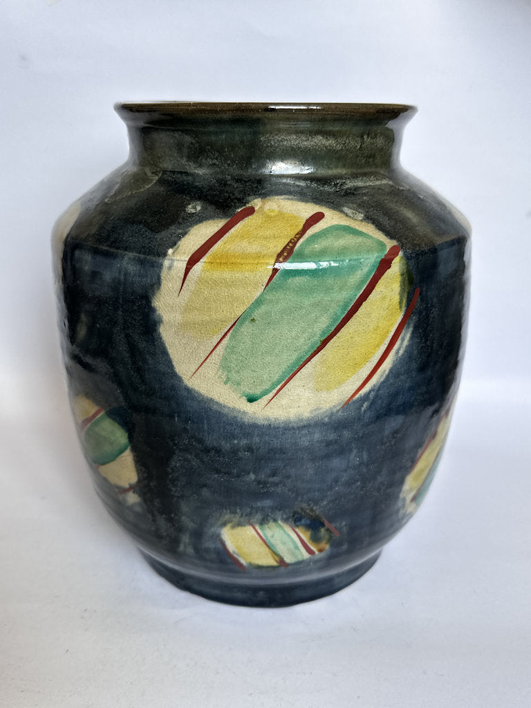 Ceramic vase with abstract design on a white background