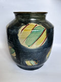 Ceramic vase with abstract design on a white background