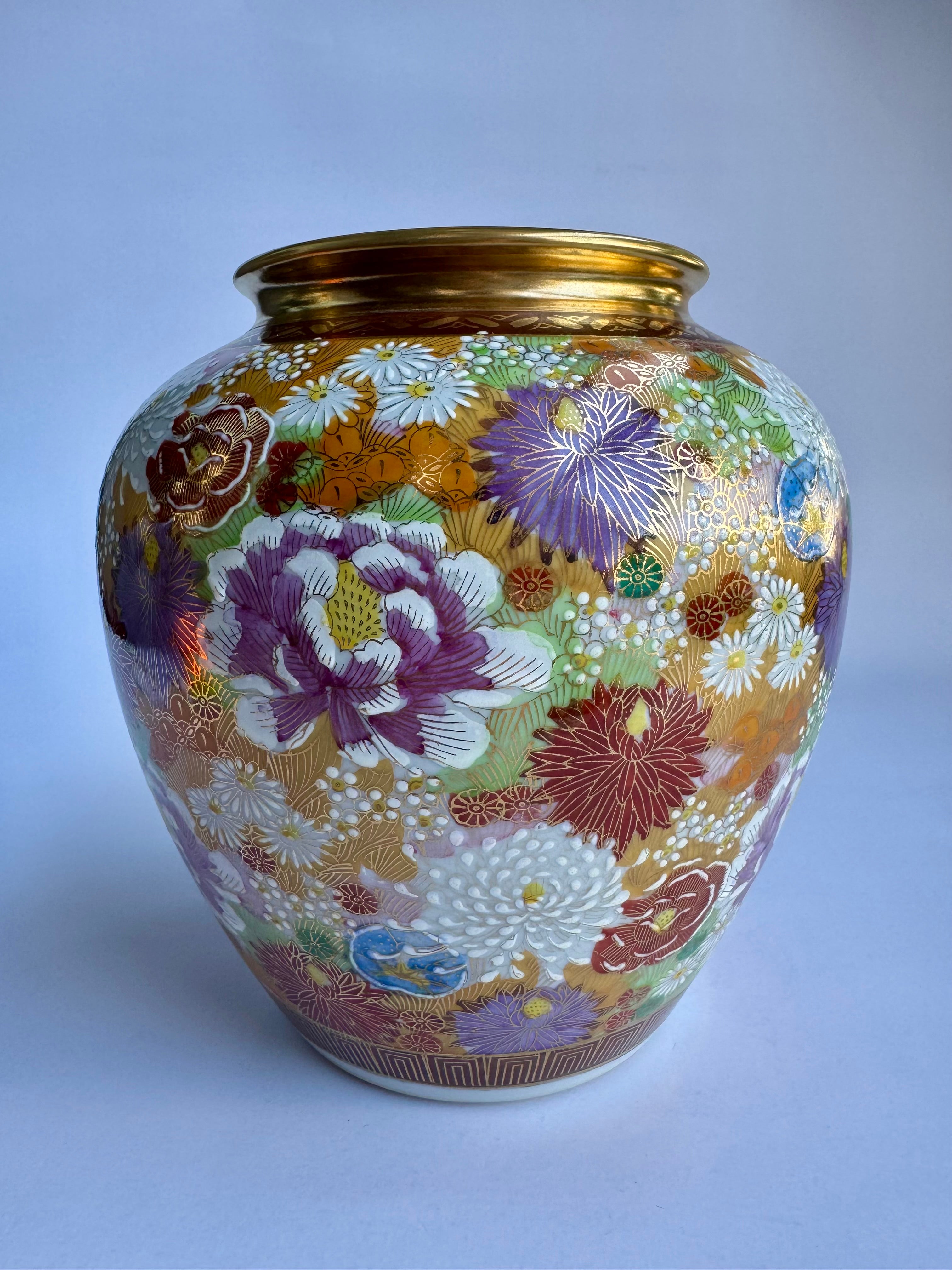 Decorative vase with floral patterns on a light gray background
