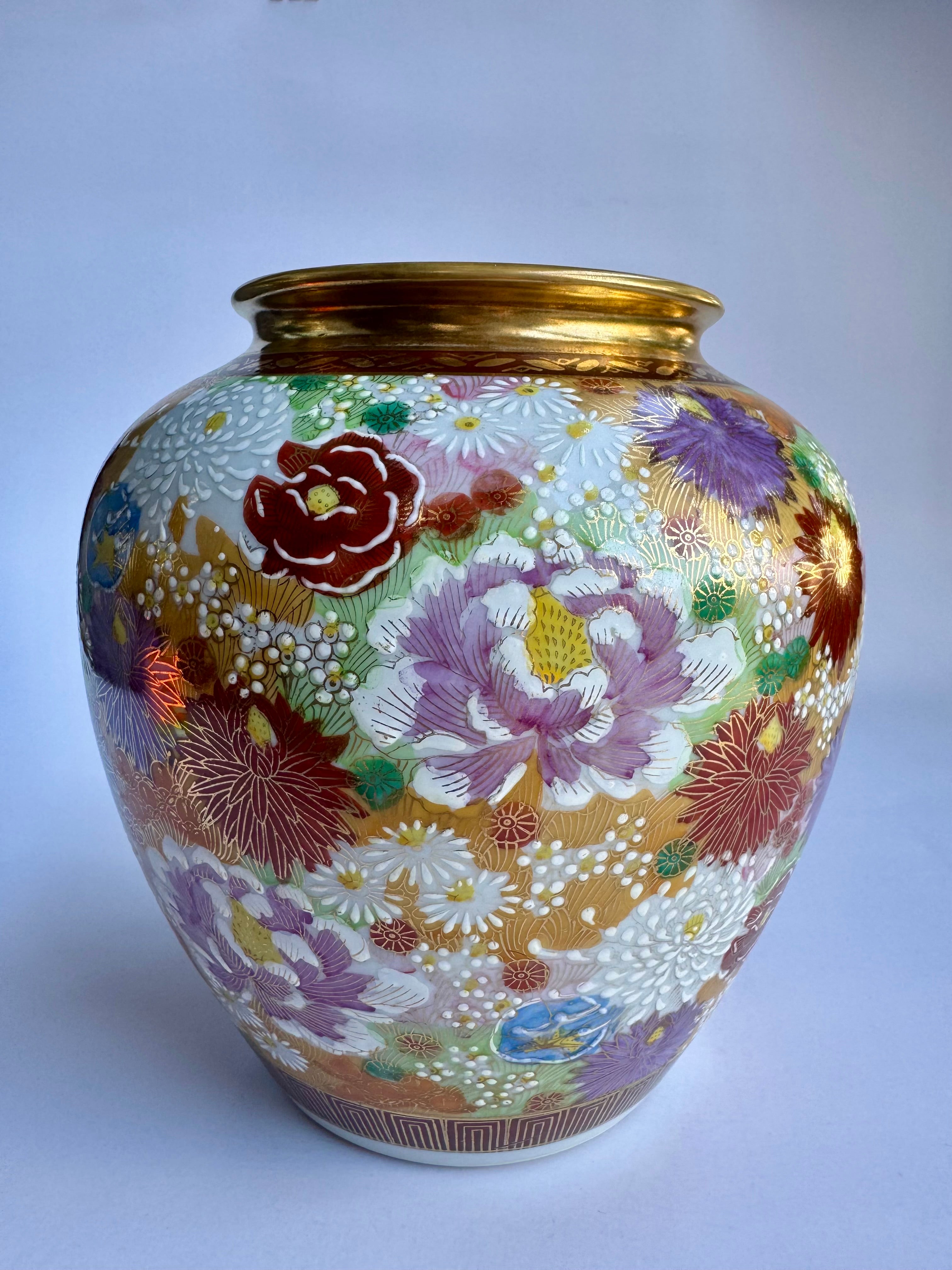 Decorative vase with floral patterns on a white background
