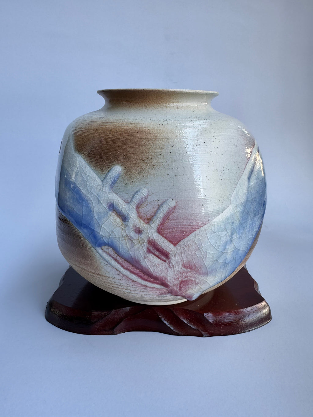 “Kyoto pottery vase by Masafumi Fujiwara with blue-red crackle glaze.”