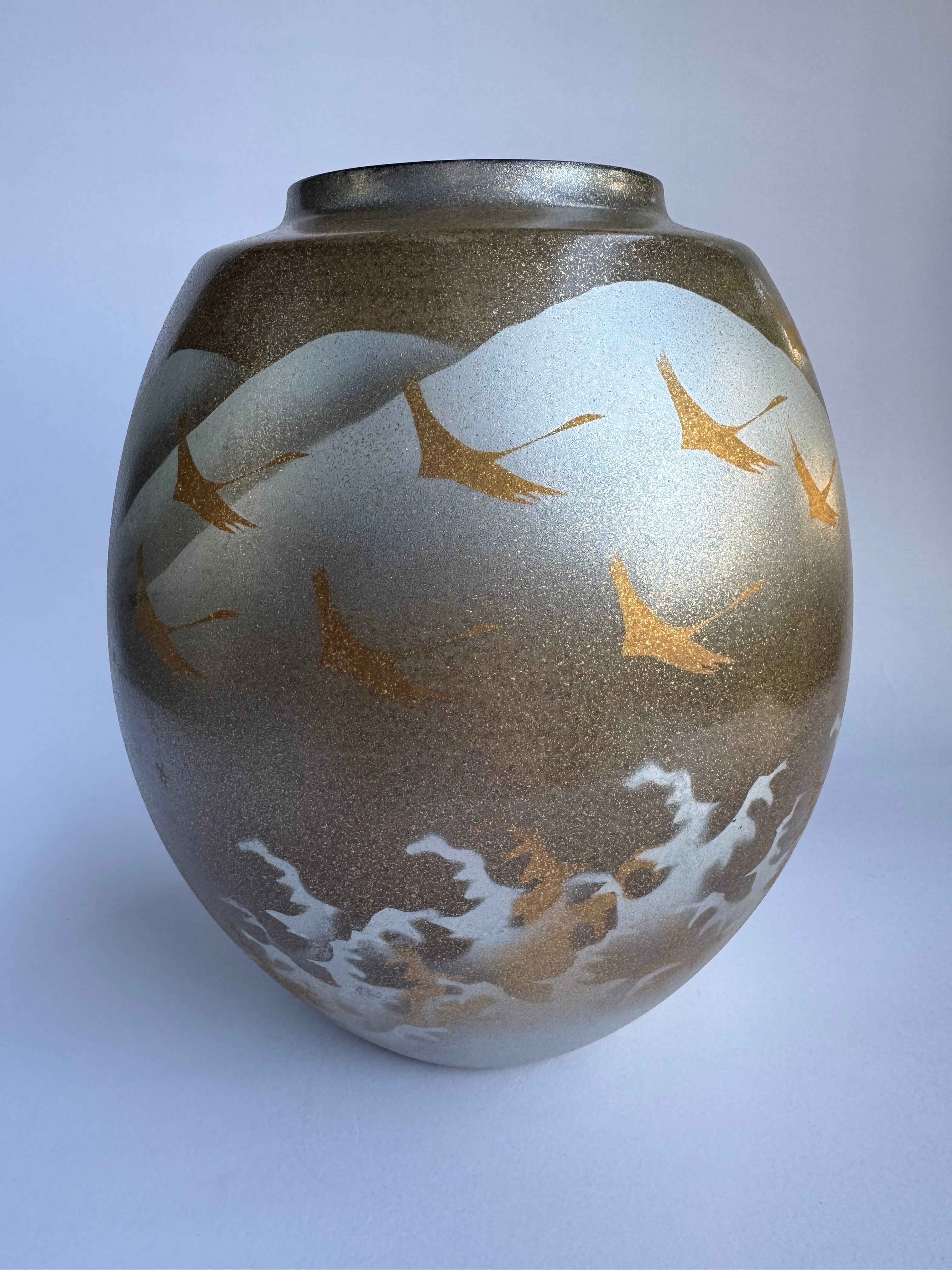 Decorative vase with gold leaf patterns