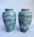 Two ceramic vases with mountain landscape design 