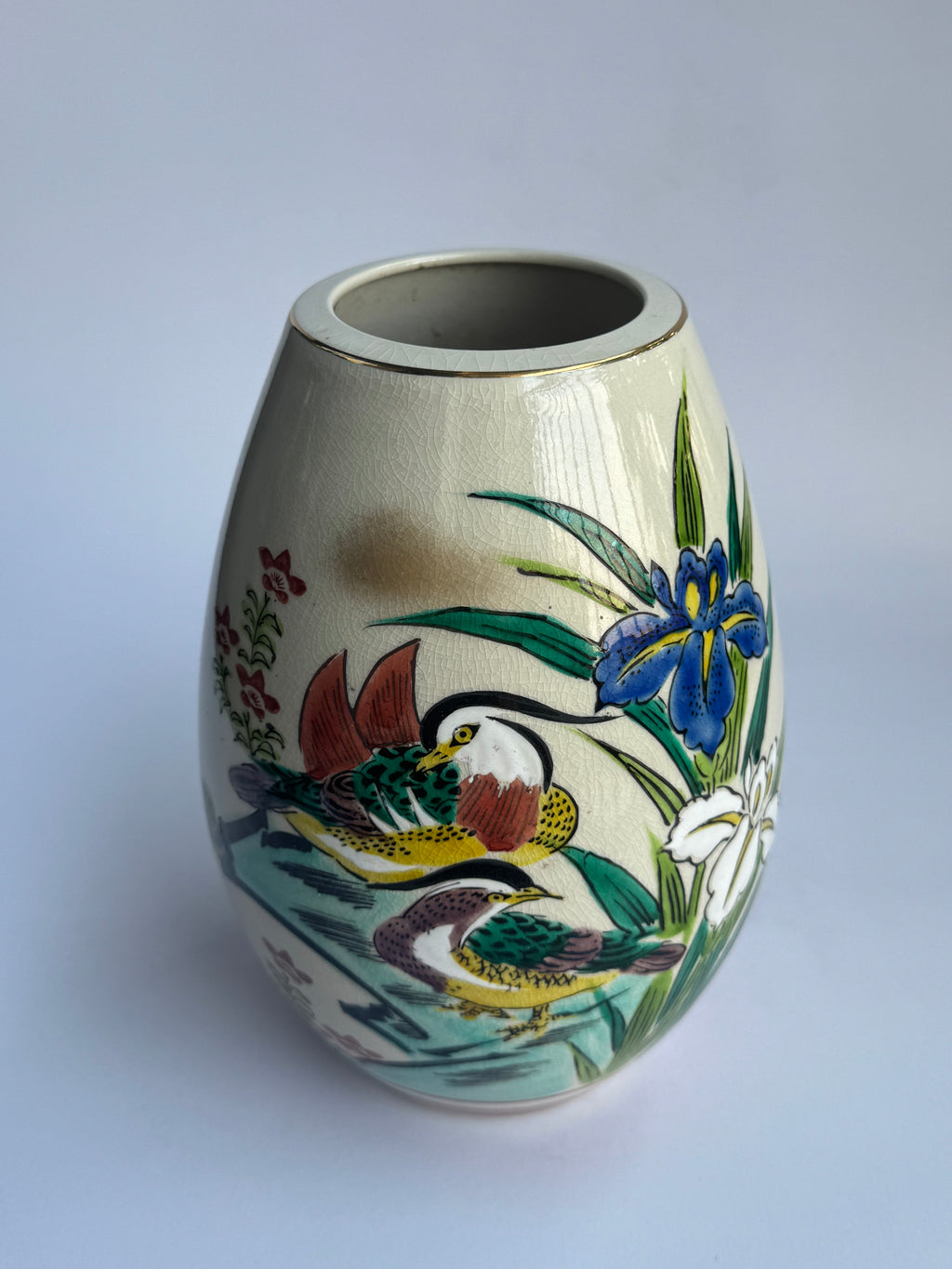 Decorative ceramic vase with floral and bird design 