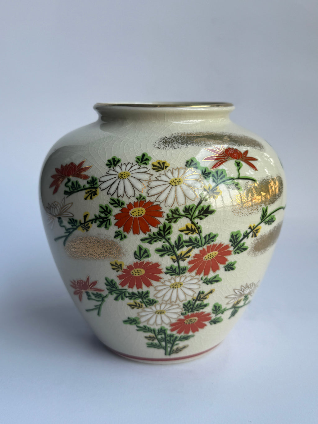 Ceramic vase with floral patterns on a white background
