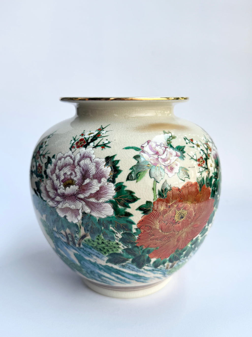 Decorative vase with floral patterns on a white background
