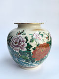 Decorative vase with floral patterns on a white background