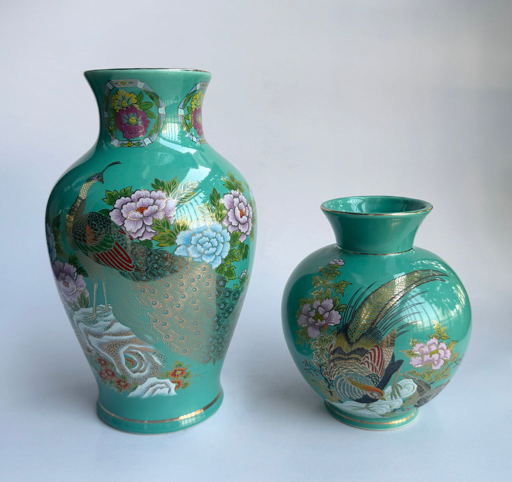 Two decorative vases with floral and peacock designs 