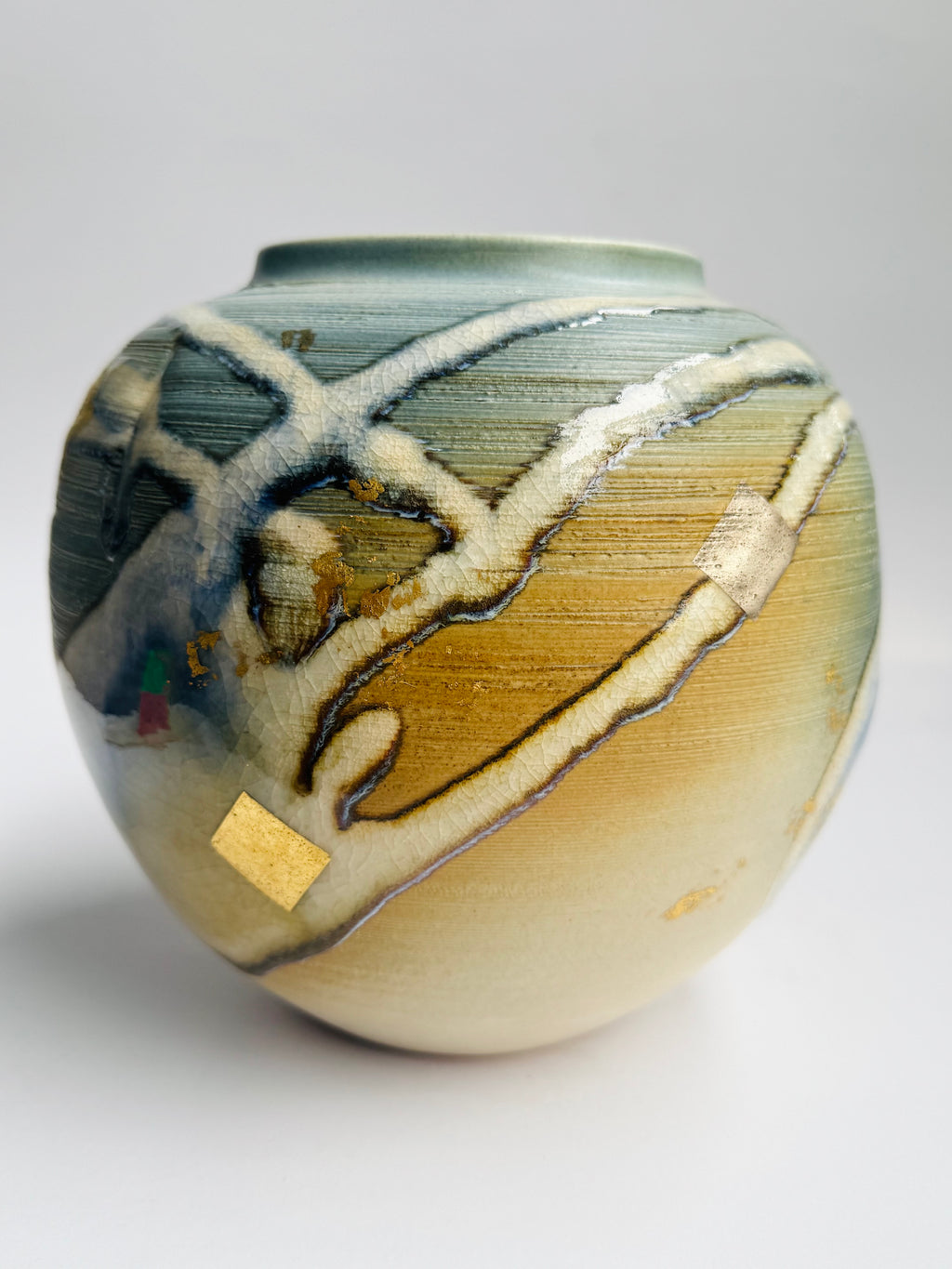 Ceramic vase with artistic design on a gray background