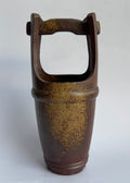 A handcrafted Bizen ikebana vase in traditional bucket form