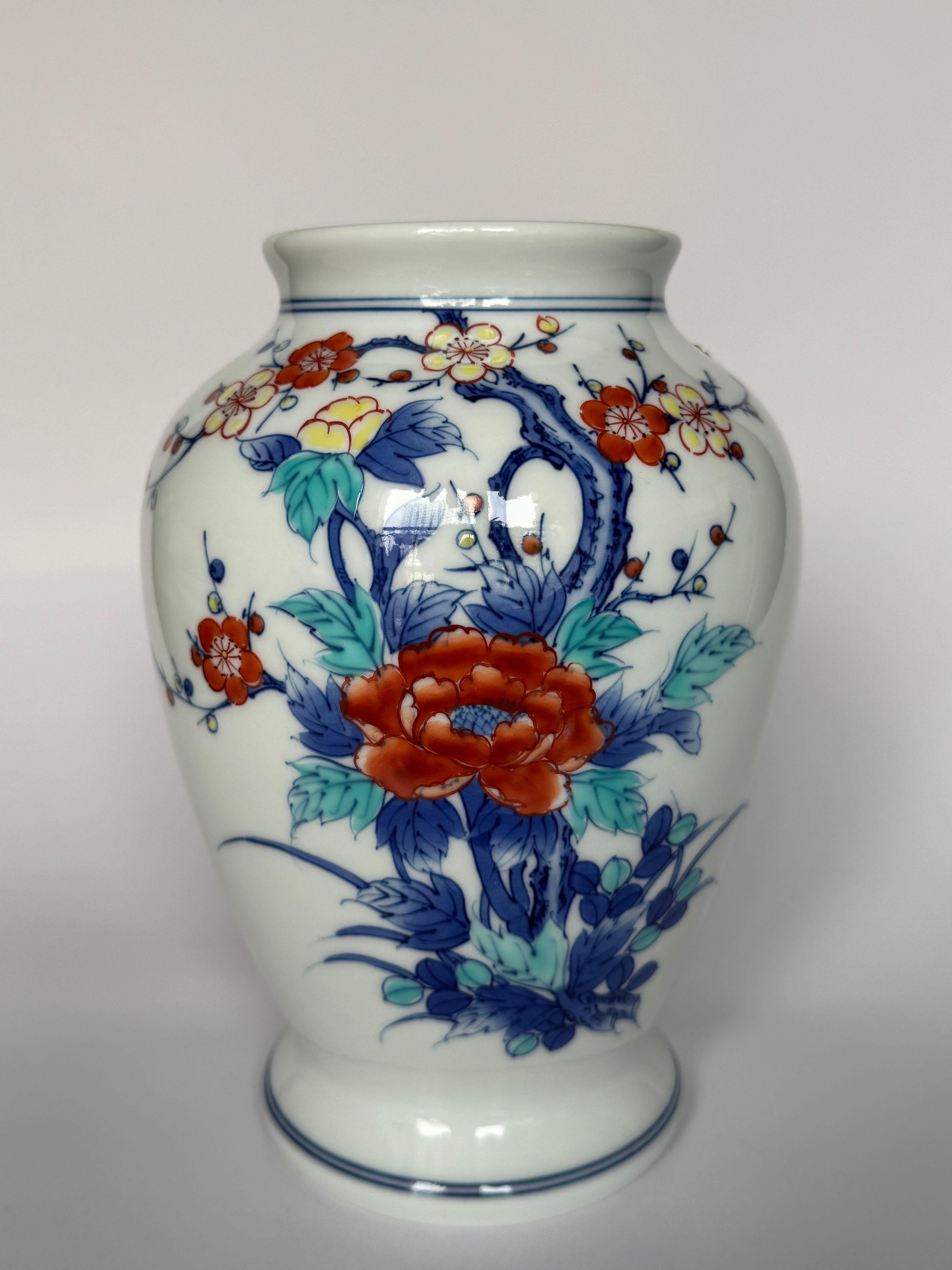 Decorative vase with floral patterns on a white background
