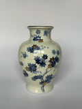 Decorative vase with floral patterns on a white background