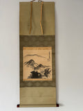 Traditional landscape painting in a decorative scroll frame on a plain background