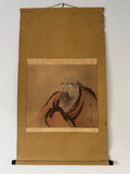 Traditional Japanese scroll with a portrait of a man on a plain background