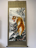 Wall scroll with a tiger painting in a mountainous landscape