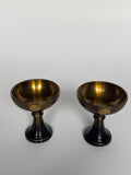 Two bronze bowls on a white background