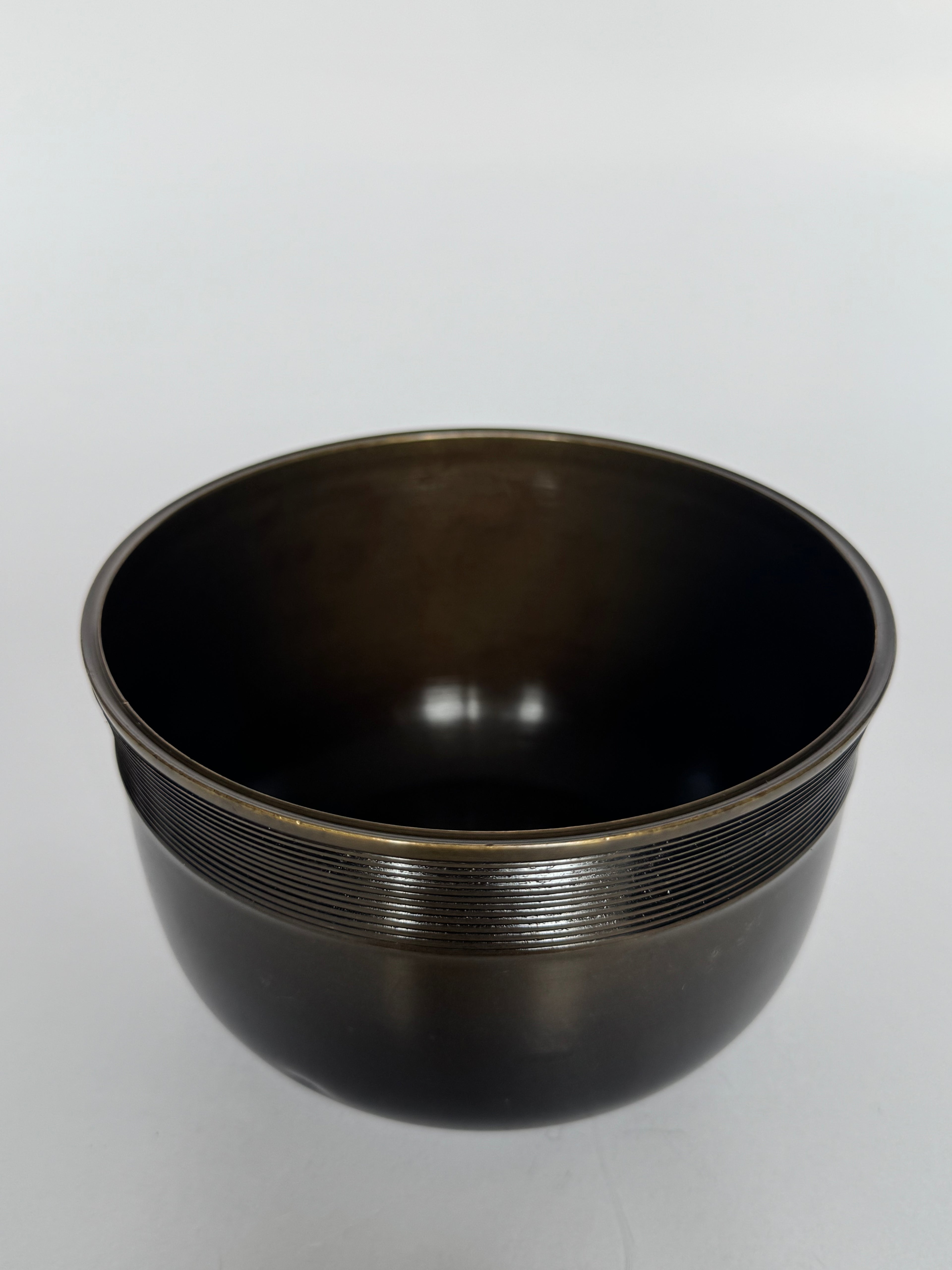 Bronze bowl on a white background