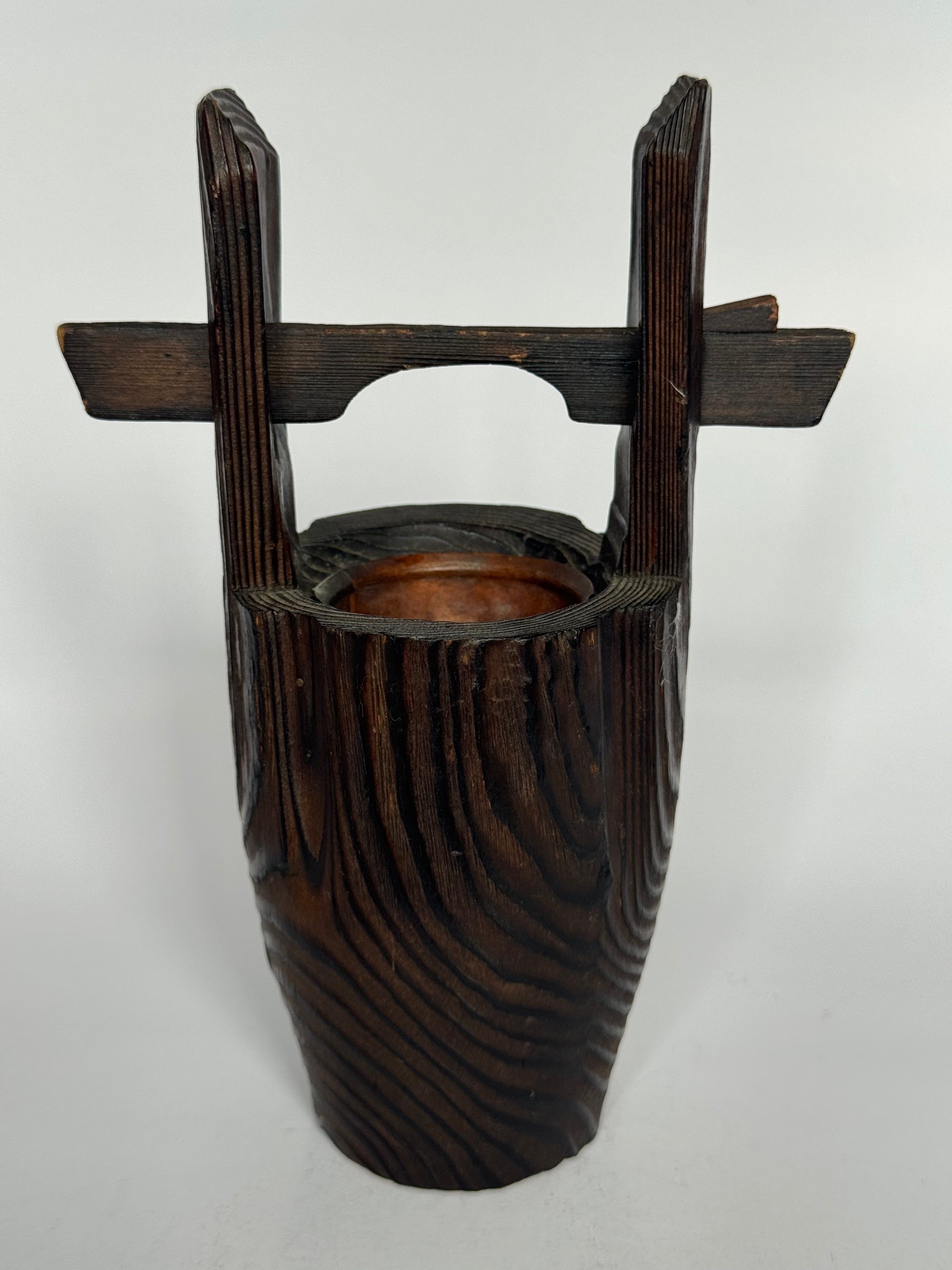 Wooden bucket with handles on a white background