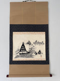 Traditional Japanese scroll with landscape design on a beige background