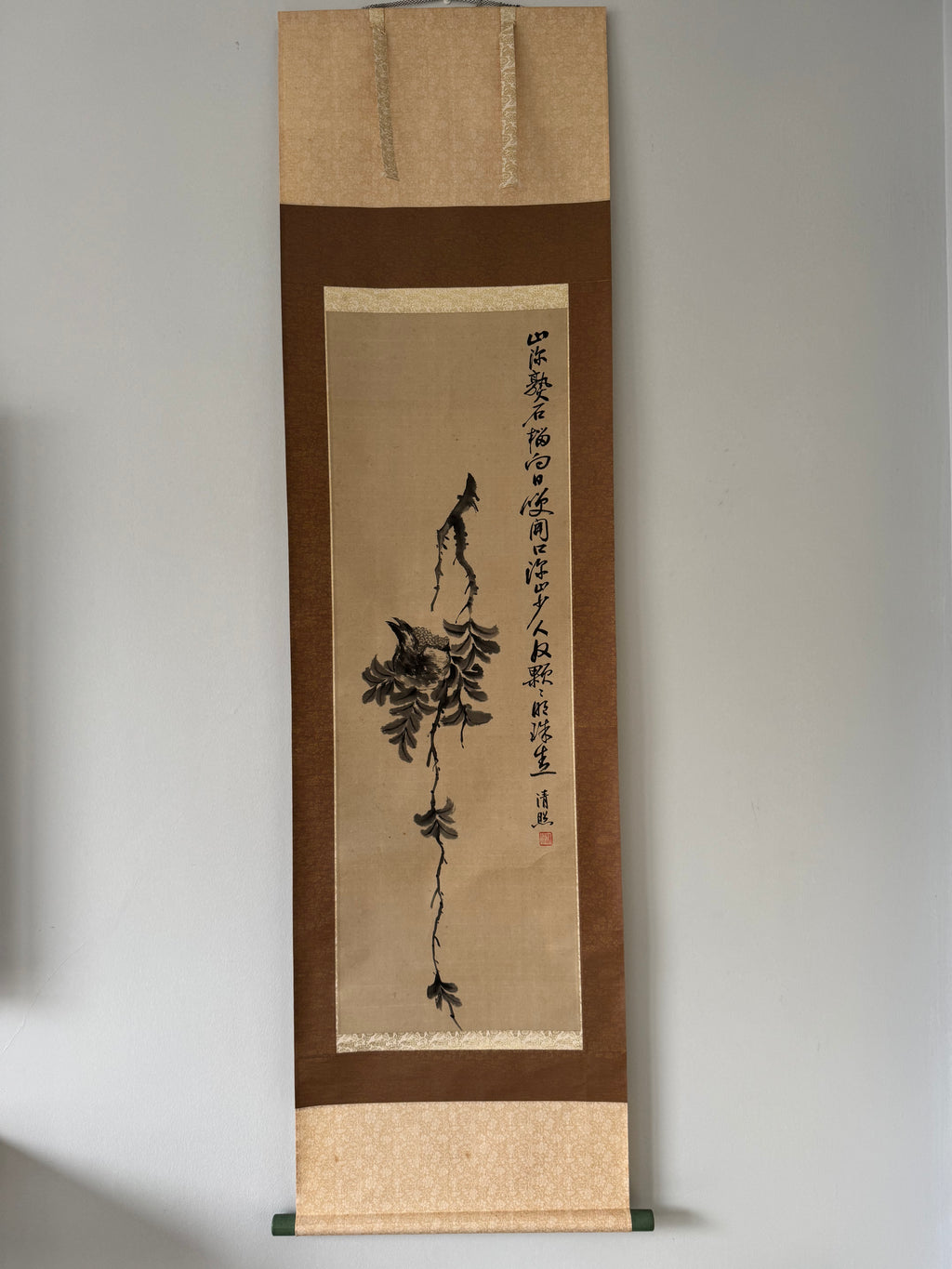 Vertical scroll with ink painting and calligraphy on a plain background