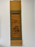 Traditional Japanese scroll with landscape design on a plain background