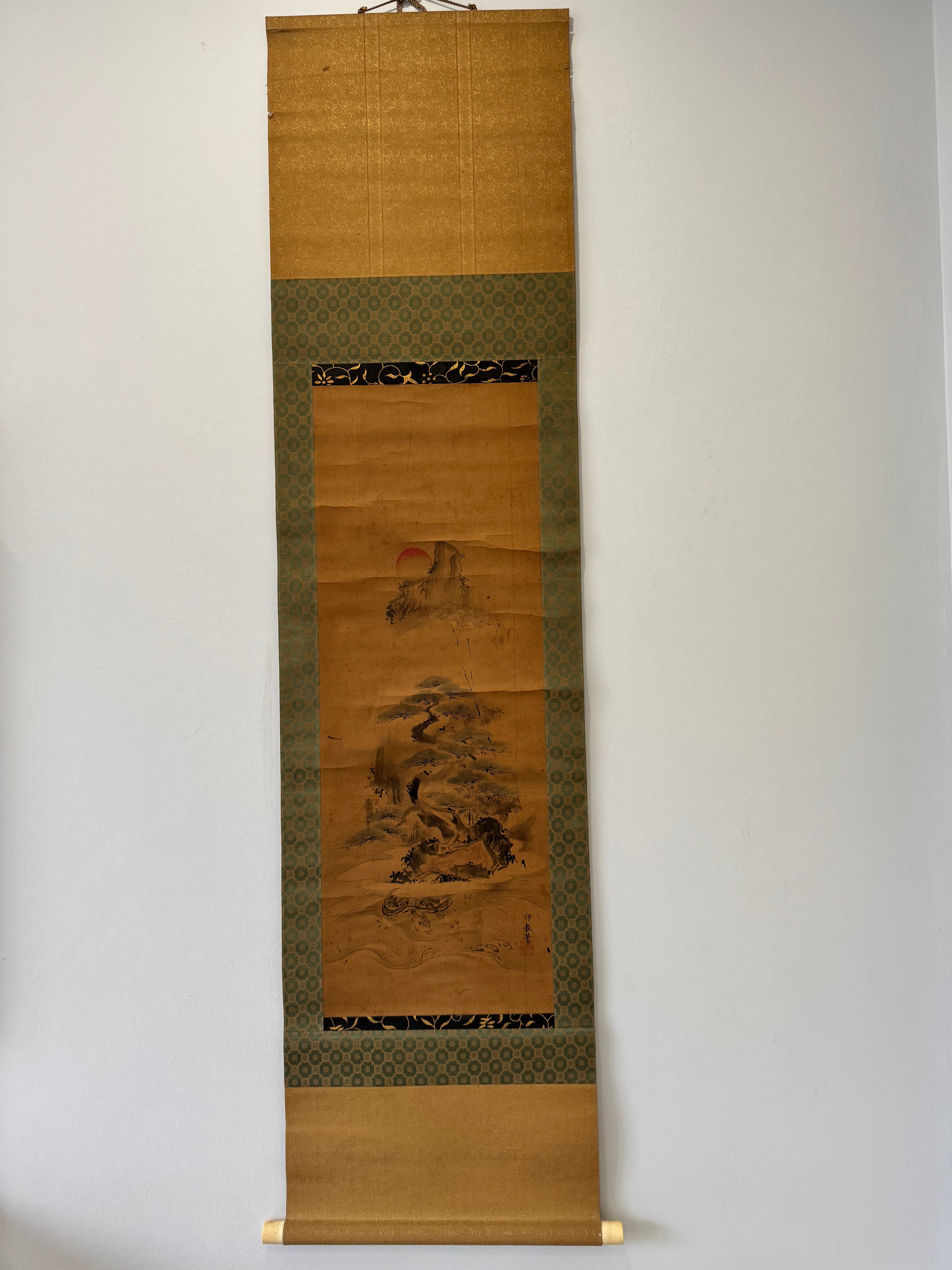Traditional Japanese scroll with landscape design on a plain background