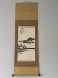 Traditional landscape painting on a hanging scroll with gold border
