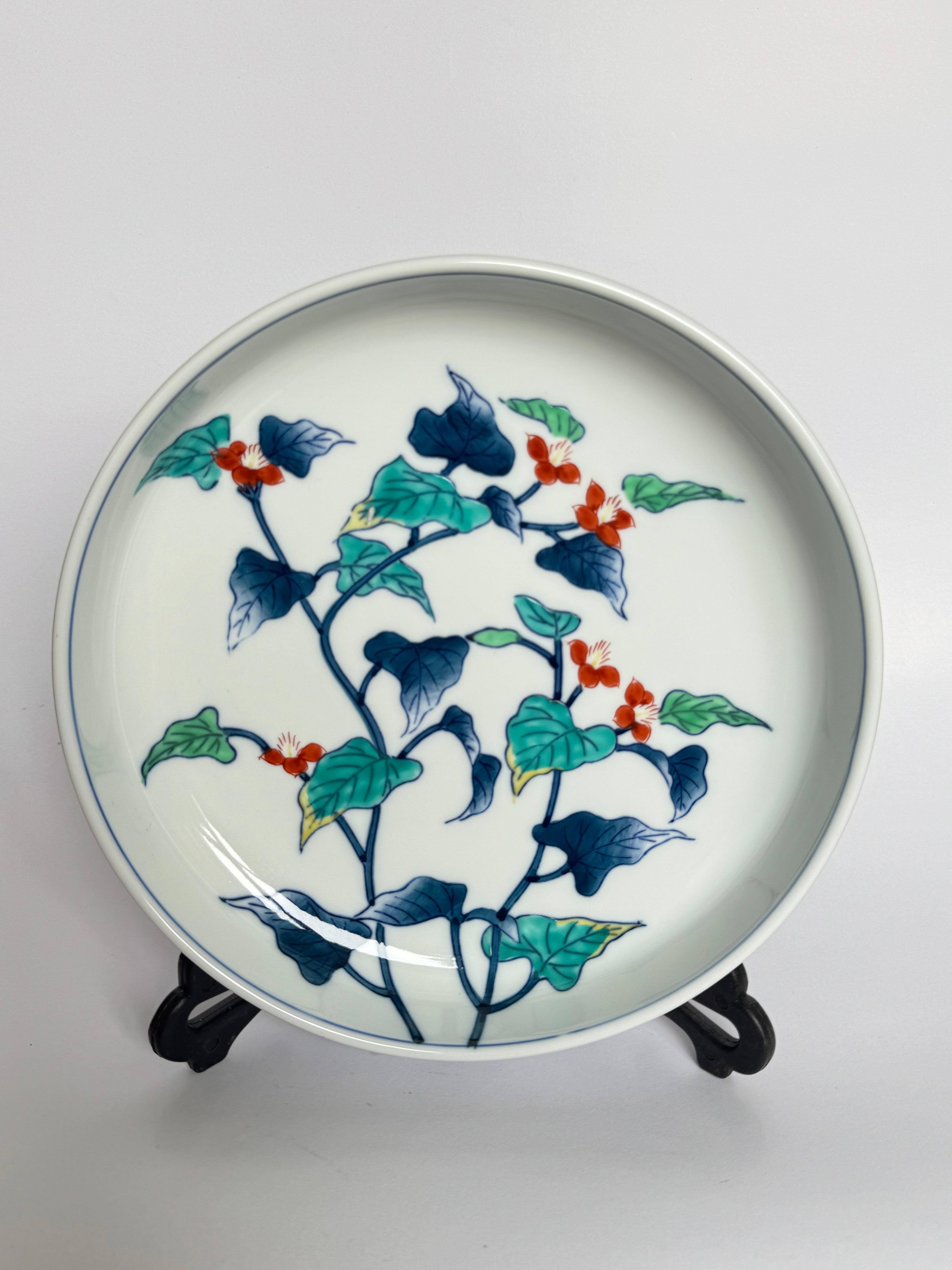 Decorative ceramic plate with floral design on a white background