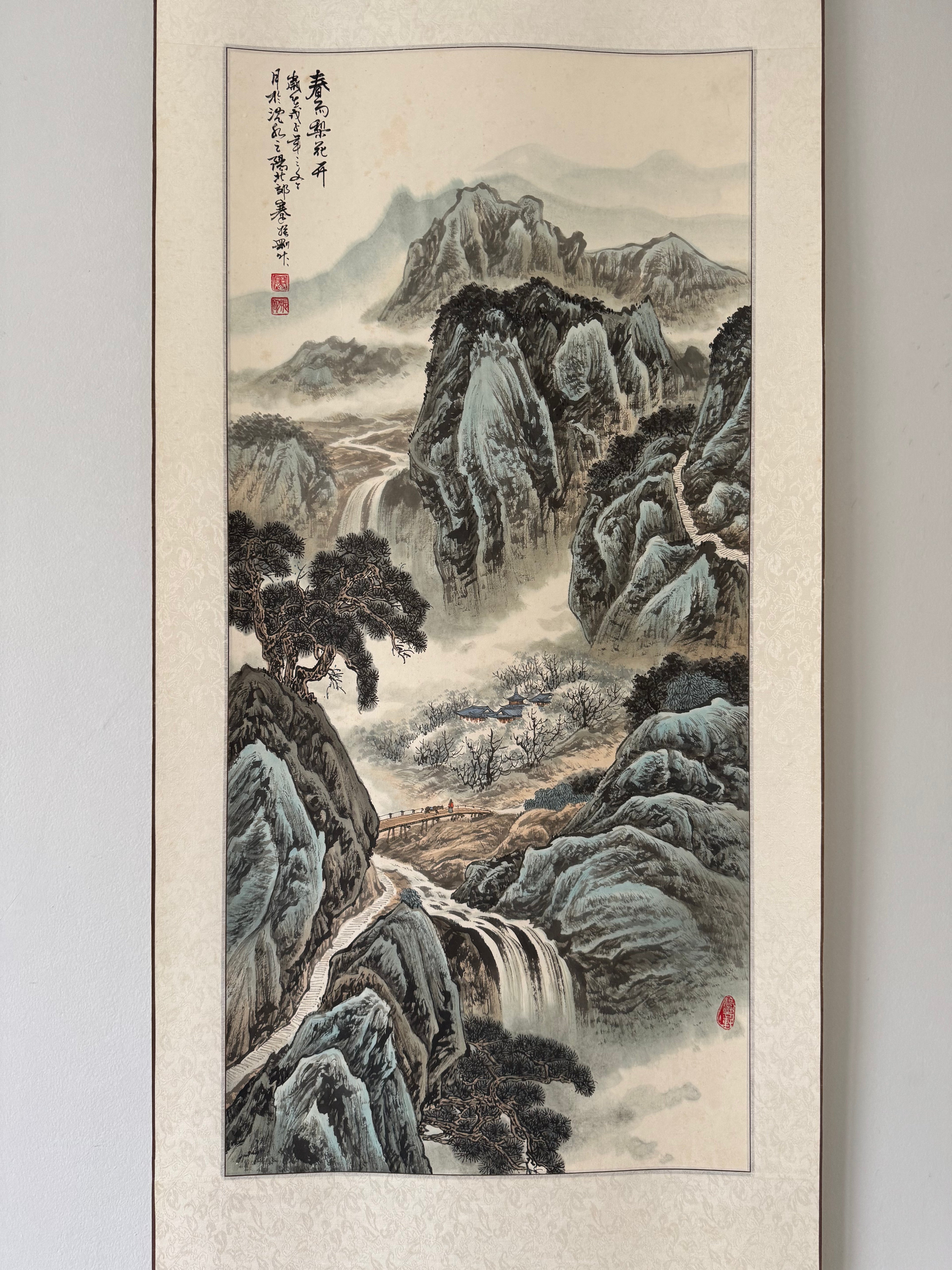 Traditional Japanese landscape painting with mountains and a waterfall on a beige background