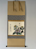 Traditional Japanese scroll with floral design on a plain background