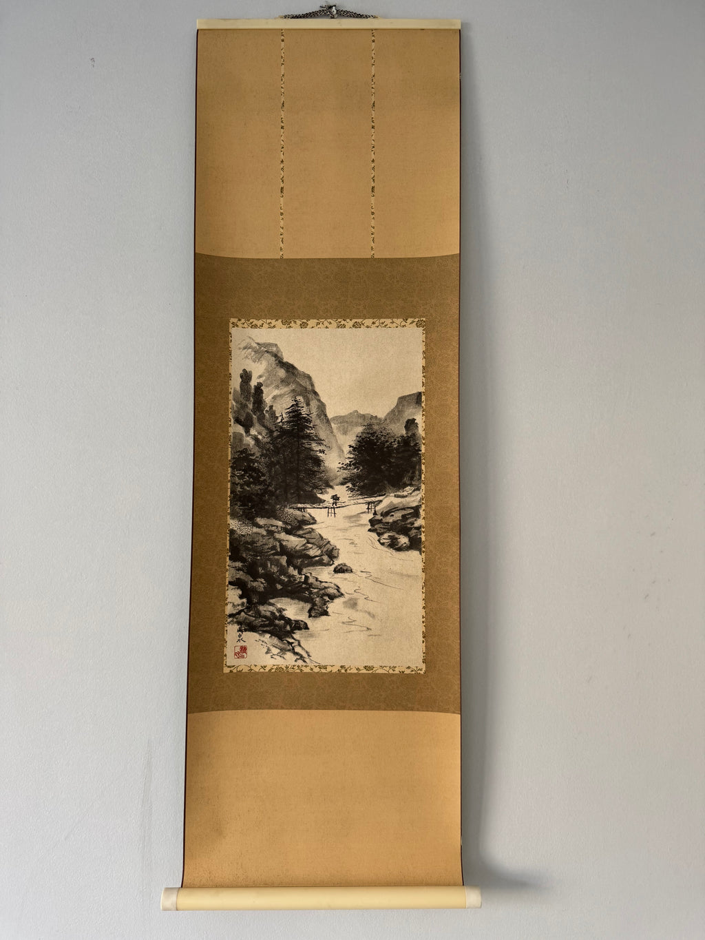 Traditional Japanese landscape scroll on a plain background