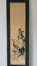 Traditional Japanes painting of a rooster on a vertical scroll with a black frame.