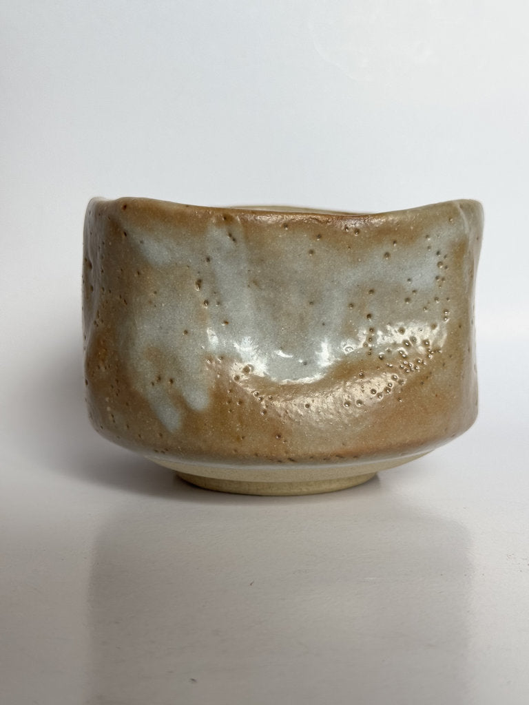 Ceramic bowl with a textured surface on a white background
