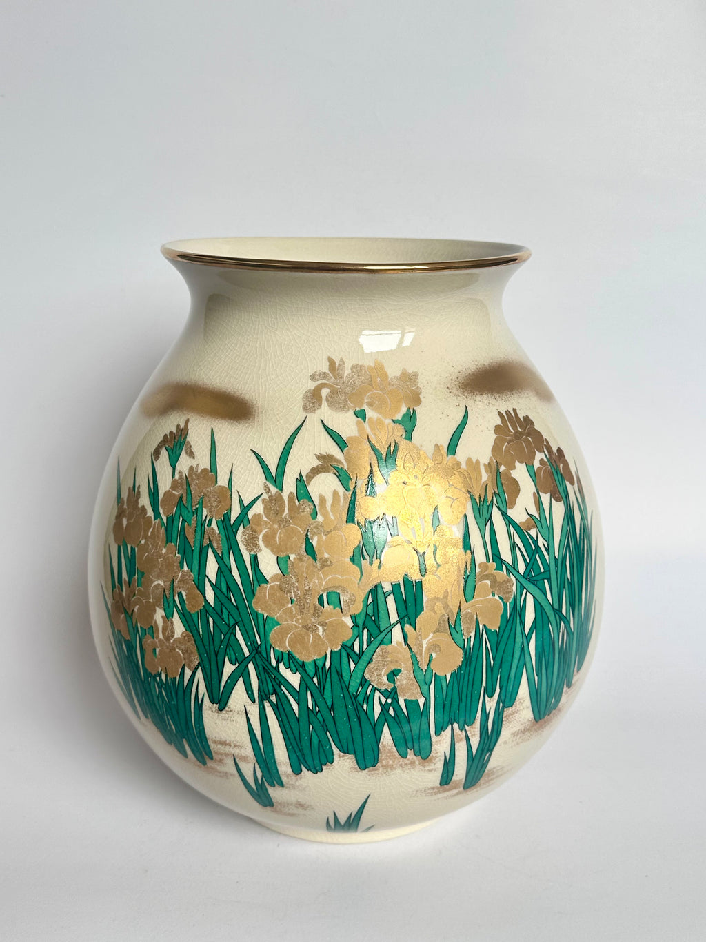 Decorative vase with floral design on a plain background