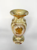 Decorative glass vase with brown and beige patterns on a white background