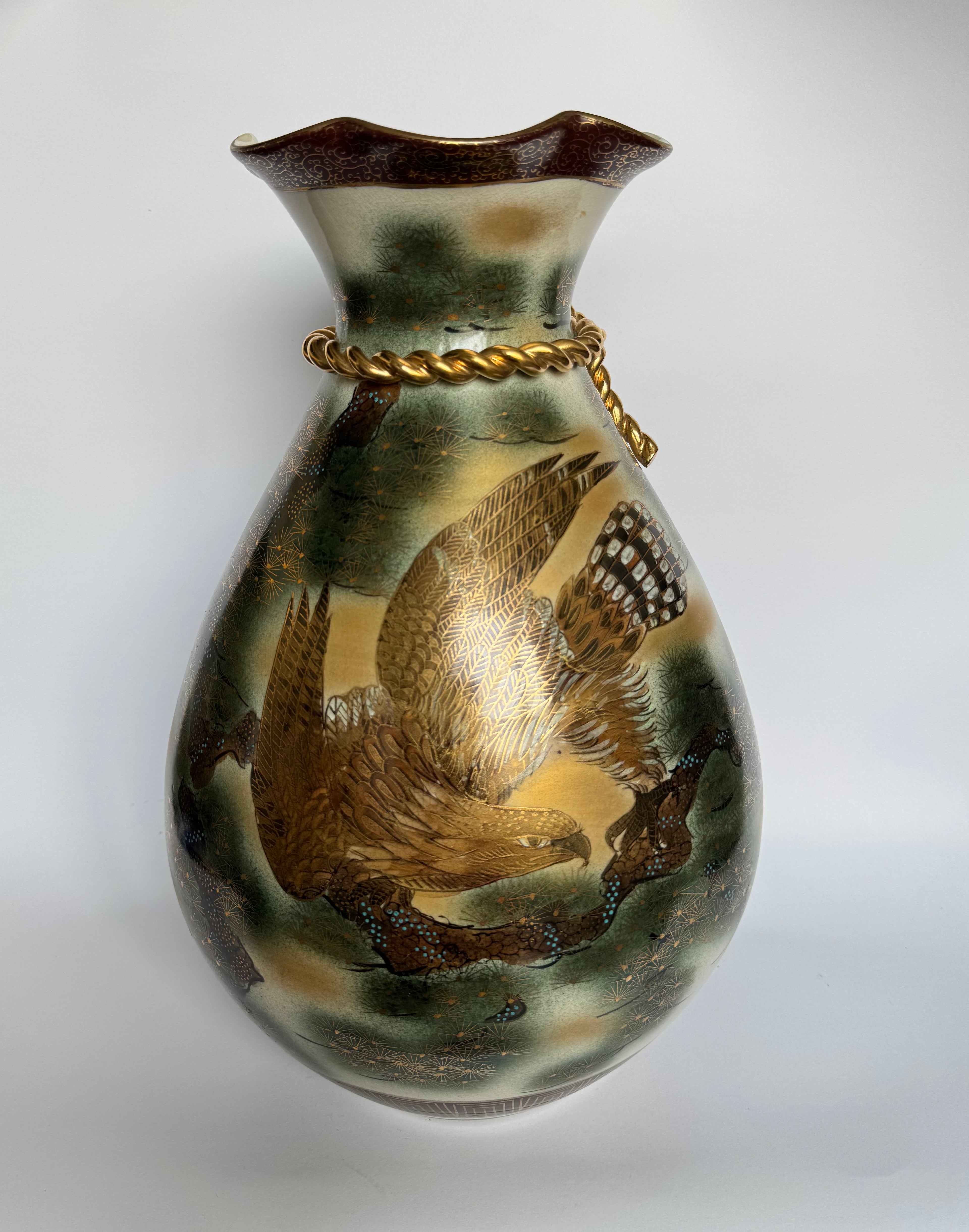Decorative vase with bird design on a white background